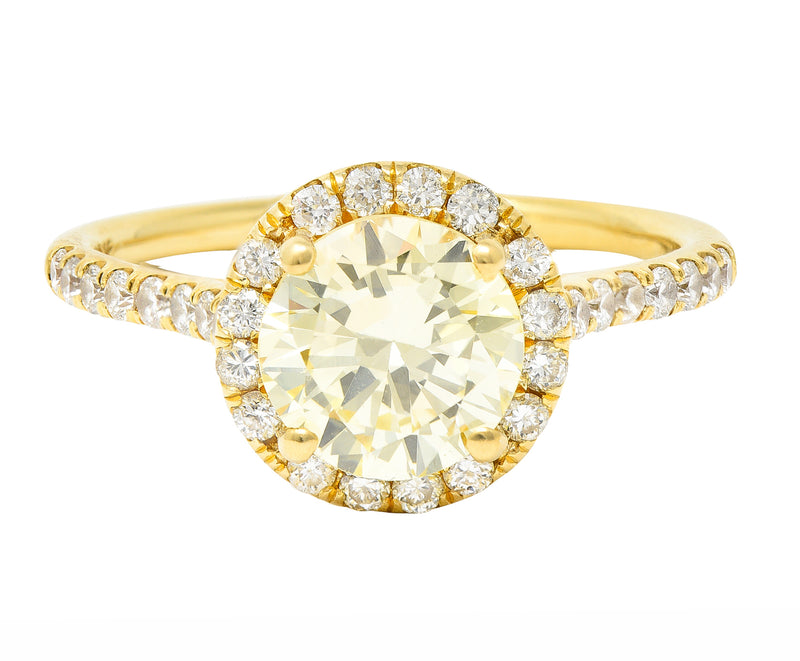 Contemporary 1.65 CTW Fancy Light Yellow Diamond 18 Karat Yellow Gold Halo Engagement Ring GIA